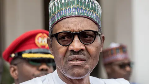 FILED - 31 August 2018, Nigeria, Abuja: Nigerian President Muhammadu Buhari stands in front of State House. Buhari said a state-wide ban on Twitter which prompted international condemnation over the weekend was only a temporary measure in response to misinformation, in comments posted on Facebook. Photo: Michael Kappeler/dpa