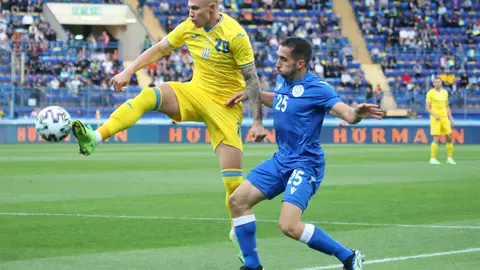 07 June 2021, Ukraine, Kharkiv: Ukraine's Oleksandr Zubkov and Cyprus' Andreas Panayiotou Filiotis in action during the International Friendly soccer match between Ukraine and Cyprus at Matalist Regional Sports Complex. Photo: -/Ukrinform/dpa