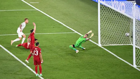11 June 2021, Italy, Rome: Italy's Ciro Immobile (L) scores his side's seond goal past Turkey goalkeeper Ugurcan Cakir during the UEFA EURO 2020 Group A soccer match between Italy and Turkey at the Olympic Stadium. Photo: Matthias Balk/dpa