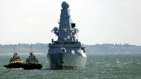 18 June 2021, Ukraine, Odesa: The Royal Navy destroyer HMS Defender arrives in the port of Odessa. The Russian military warned away the British Navy's HMS Defender warship with bombs and gunfire after it allegedly entered Russian territorial waters near the Crimean Peninsula on Wednesday, the TASS news agency reports. Photo: -/Ukrinform/dpa