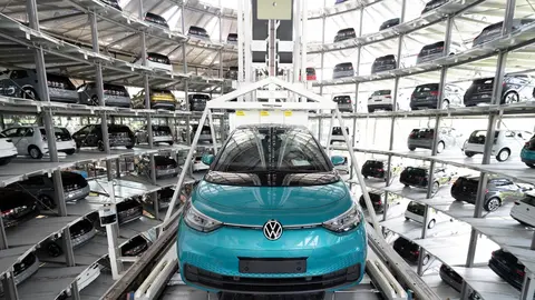 FILED - 08 June 2021, Saxony, Dresden: A finished VW ID.3 is transported into a car tower during a press tour of Volkswagen's Transparent Factory. At the site in Dresden, 35 fully electric vehicles are produced every day. Europe's biggest carmaker Volkswagen posted a sharp rise in global sales on Friday as the world's auto industry rebounded from a crisis unleashed by the pandemic. Photo: Sebastian Kahnert/dpa-Zentralbild/ZB