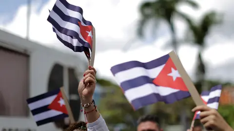 FILED - Demonstrators wave flags of Cuba during a rally in front of the Cuban Embassy in support of the island's government. Scores of people had demonstrated the day before in Havana and several other Cuban cities against the economy of scarcity and oppression. Observers spoke of the largest demonstrations in Cuba in decades. Photo: Jesus Vargas/dpa
