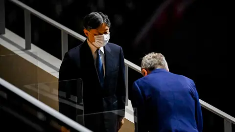 23 July 2021, Japan, Tokyo: Thomas Bach (R), President of the International Olympic Committee (IOC), greets Japan's Emperor Naruhito during the opening ceremony of the Tokyo 2020 Olympic Games at the Olympic Stadium. The ceremony is attended by only 950 VIPs due to the coronavirus pandemic. Photo: Dirk Waem/BELGA/dpa