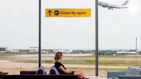 29 July 2021, United Kingdom, London: A general view of "Come Fly Again" signage at London's Heathrow Airport during a celebration for the safe reopening of international travel and its 75th anniversary. Photo: David Parry/PA Wire/dpa