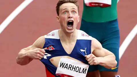 03 August 2021, Japan, Tokyo: Norway's Karsten Warholm celebrates gold after finishing the Men's 400m Hurdles Final of the athletics competition at the Olympic Stadium during the Tokyo 2020 Olympic Games. Photo: Oliver Weiken/dpa