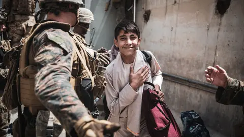 18 August 2021, Afghanistan, Kabul: US Marines check civilians at an Evacuee Control Checkpoint during the evacuation process at Hamid Karzai International Airport. Photo: Ssgt. Victor Mancilla/U.S. Marin/Planet Pix via ZUMA Press Wire/dpa