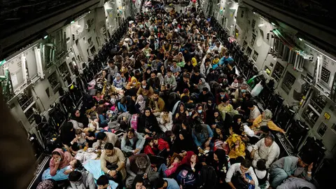 19 August 2021, Afghanistan, Kabul: Afghan citizens crowd on board US Air Force C-17 Globemaster III airplane as they are being evacuated from Hamid Karzai International Airport in Kabul. The evacuation is taking place due to the tense situation in Afghanistan after the takeover of the Taliban. Photo: Ssgt. Brandon Cribelar/U.S. Air/Planet Pix via ZUMA Press Wire/dpa