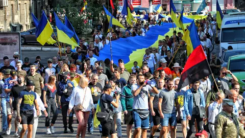 24 August 2021, Ukraine, Odesa: Participants of the March of Defenders of Ukraine move down the city street towards the Heavenly Hundred Square. Photo: -/Ukrinform/dpa
