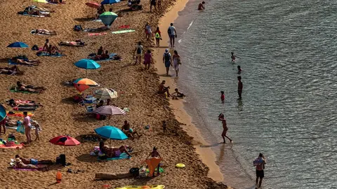 31 August 2021, Spain, Mercadal: Beachgoers enjoy the Mediterranean sea at the sunny Cavalleria beach at Menorca's north coast. Photo: Matthias Oesterle/ZUMA Press Wire/dpa
