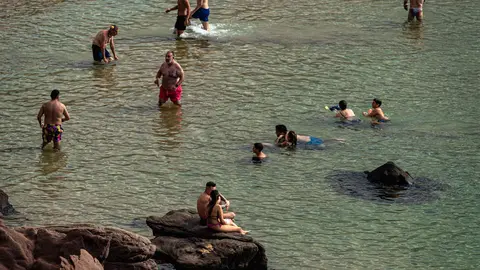 31 August 2021, Spain, Mercadal: Beachgoers enjoy the Mediterranean sea at the sunny Cavalleria beach at Menorca's north coast. Photo: Matthias Oesterle/ZUMA Press Wire/dpa