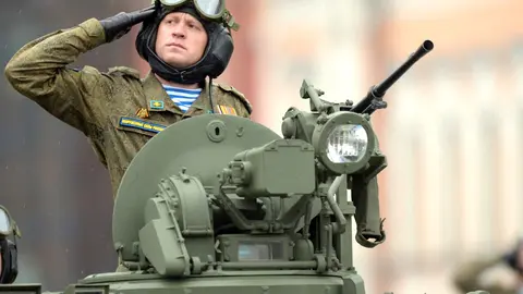 FILED - A Russian soldier salutes as he takes part in the Victory Day Military Parade in Red Square to mark the 76th anniversary of the Victory in the Great National War of 1941-1945. Photo: -/Kremlin/dpa - ATTENTION: editorial use only and only if the credit mentioned above is referenced in full