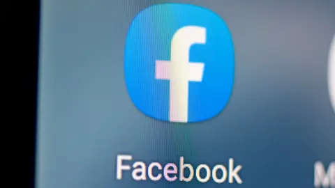 FILED - 28 April 2021, Berlin: The logo of the Facebook app is seen on the screen of a smartphone. Facebook intends to change its name, according to a report by US technology website The Verge published on Wednesday. Photo: Fabian Sommer/dpa