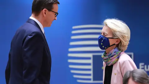 HANDOUT - Poland's Prime Minister Mateusz Morawiecki (L) speaks with European Commission President Ursula Von der Leyen during the European Union summit at The European Council. Photo: Zucchi Enzo/European Council/dpa - ATTENTION: editorial use only and only if the credit mentioned above is referenced in full