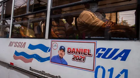 FILED - "Daniel 2021," reads next to a picture of Nicaraguan President Daniel Ortega on a public transportation bus. Five candidates for the presidential candidacy from opposition alliances were arrested within a few weeks. Photo: -/dpa.