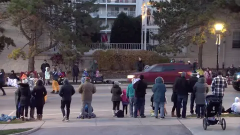 21 November 2021, US, Waukesha: An image captured from a video posted by the City of Waukesha on Facebook shows a red vehicle speeding through the Waukesha Christmas parade in Wisconsin. Several people were dead and dozens injured. Photo: -/TNS via ZUMA Press Wire/dpa.