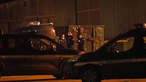 Gendarmes outside a warehouse in the Port of Calais, France, where it is believed the bodies of migrants are being transported after recovery from a boat which capsized off the French coast with the loss of 31 lives on Wednesday. An emergency search was sparked when a fishing boat sounded the alarm after spotting several people in the sea off the coast of France. Authorities found 31 bodies and two survivors while one person was missing. Picture date: Wednesday November 24, 2021. Photo: Stefan Rousseau/PA Wire/dpa.