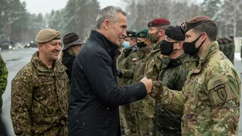 29 November 2021, Latvia, Adazi: NATO Secretary General Jens Stoltenberg (3rd L), Canadian Minister for Foreign Affairs Melanie Joly (2nd L) and the Latvian Minister of Defence Artis Pabriks (L) visit the NATO enhanced Forward Presence (eFP) battlegroup at the Adazi Military Base. Photo: -/NATO/dpa.