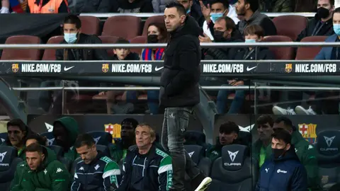 04 December 2021, Spain, Barcelona: Barcelona's Xavi Hernandez stands on the touchline during the Spanish La Liga soccer match between FC Barcelona and Real Betis at Camp Nou. Photo: Gerard Franco/DAX via ZUMA Press Wire/dpa.