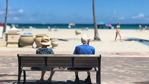 old elderly couple retired retirement beach Photo: Pexels