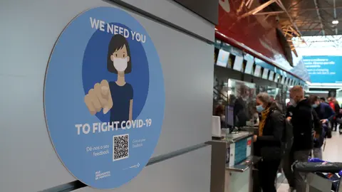 FILED - A Corona warning sign "We Need You" hangs at Humberto Delgado International Airport. In Portugal, the emergency status with new restrictions and test rules has been in effect again since Wednesday, December 1st, 2021 due to increasing corona numbers. Photo: Pedro Fiuza / ZUMA Press Wire / dpa.