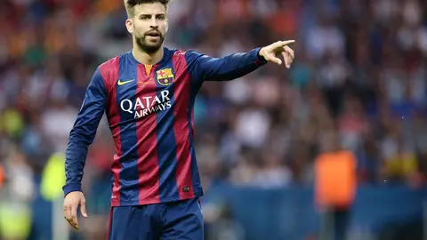 FILED - 06 June 2015, Berlin: Barcelona's Gerard Pique gestures during the UEFA Champions League final soccer match between Juventus FC and FC Barcelona at Olympiastadion in Berlin. Barcelona defender Gerard Pique has published details of his salary on Twitter after a prominent Spanish journalist suggested he and team-mates were earning significantly more at the financially stricken club. Photo: picture alliance / dpa.