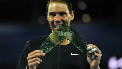 09 January 2022, Australia, Melbourne: Spanish tennis player Rafael Nadal celebrates with the trophy after defeating USA's Maxime Cressy in their Men's Singles Final tennis match on Day 7 of the Melbourne Summer Set tennis tournament at Melbourne Park. Photo: James Ross/AAP/dpa.