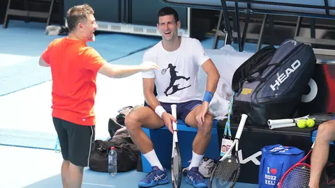 11 January 2022, Australia, Melbourne: Serbian tennis player Novak Djokovic (R) takes part in a practice session ahead of the Australian Open at Melbourne Park. The court had yesterday upheld an appeal from Djokovic against the cancellation of his visa in connection with coronavirus rules. Photo: Scott Barbour/TENNIS AUSTRALIA via AAP/dpa.