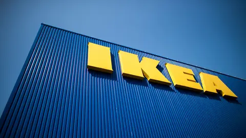 FILED - 17 April 2020, North Rhine-Westphalia, Cologne: The lettering IKEA can be seen on the facade of a furniture store. Big Box furniture retail chain IKEA has decided to cut sick pay for workers who have not received a coronavirus vaccine jab yet and have to isolate because they were exposed to the virus and have tested positive. Photo: Federico Gambarini/dpa.