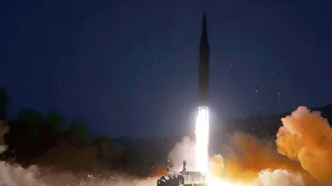 HANDOUT - 11 January 2022, North Korea, ---: A picture provided by the North Korean Central News Agency (KCNA) shows a missile launching from a mobile launch pad. North Korea's National Defence Academy said it was a test launch of a hypersonic missile. Photo: -/KCNA/dpa.
