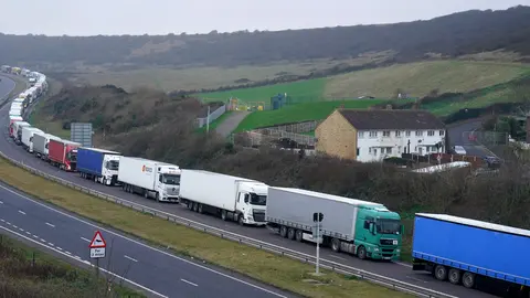 11 January 2022, United Kingdom, Dover: Lorries queue on the A20 for the Port of Dover in Kent, where delays are being caused to the transportation of goods across the channel after exports between Great Britain and the EU became subject to full customs controls on 1 January 2022. Photo: Gareth Fuller/PA Wire/dpa.
