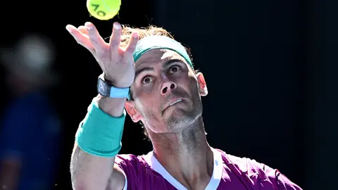 19 January 2022, Australia, Melbourne: Spanish tennis player Rafael Nadal serves against Germany's Yannick Hanfmann during their Second Round Men’s Singles tennis match on Day 3 of the 2022 Australian Open at Melbourne Park. Photo: Dave Hunt/AAP/dpa.