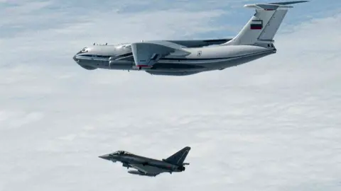A Spanish Eurofighter Typhoon jet approaches a Russian bomber during an air surveillance mission over the Baltic region. Photo: Ministerio de Defensa.