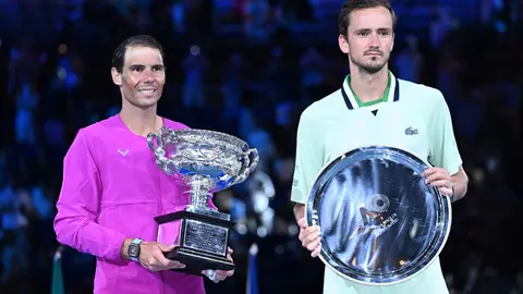 31 January 2022, Australia, Melbourne: Spanish tennis player Rafael Nadal (L) holds the Norman Brookes Challenge Cup after winning the men's singles final tennis match of the Australian Open against Russia's Daniil Medvedev (R). Photo: Dean Lewins/dpa.