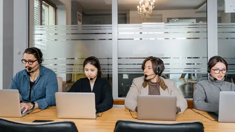 People working in an office. Photo: Pexels.