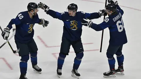 18 February 2022, China, Beijing: Sakari Manninen (C) of Team Finland celebrates with teammates after scoring a goal in the first period during the Men's Ice Hockey Playoff Semifinal match between Team Finland and Team Slovakia at National Indoor Stadium on Day Fourteen of the Beijing 2022 Winter Olympic Games. Photo: Peter Kneffel/dpa.