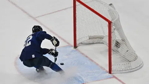 18 February 2022, China, Beijing: Harri Pesonen of Team Finland scores an empty-net goal in the third period during the Men's Ice Hockey Playoff Semifinal match between Team Finland and Team Slovakia at National Indoor Stadium on Day Fourteen of the Beijing 2022 Winter Olympic Games. Photo: Peter Kneffel/dpa.