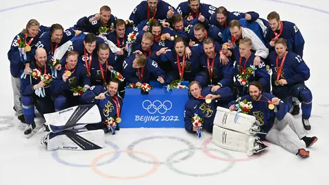 20 February 2022, China, Beijing: Finland players celebrate with their gold medals after the Men's Ice Hockey Gold medal match between Finland and Russian Olympic Committee at Beijing National Indoor Stadium, during Beijing 2022 Winter Olympic Games. Photo: Peter Kneffel/dpa.