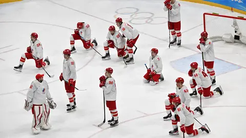 20 February 2022, China, Beijing: Russian Olympic Committee players react after losing the Men's Ice Hockey Gold medal match between Finland and Russian Olympic Committee at Beijing 2022 Winter Olympic Games. Photo: Peter Kneffel/dpa