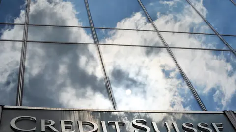 FILED - 14 July 2010, Hessen, Frankfurt_Main: A general view of the Credit Suisse bank logo placed onto the main entrance of the bank's branch in Frankfurt. Credit Suisse Group expects to achieve parity in its pre-tax profit during the fourth quarter. Photo: picture alliance / dpa.