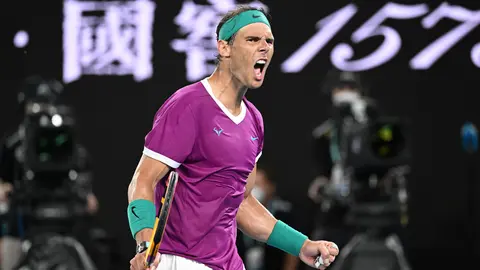 30 January 2022, Australia, Melbourne: Spanish tennis player Rafael Nadal celebrates winning the third set during his Men's Singles Final tennis match against Russia's Daniil Medvedev on Day 14 of the Australian Open at Melbourne Park. Photo: Dave Hunt/AAP/dpa.