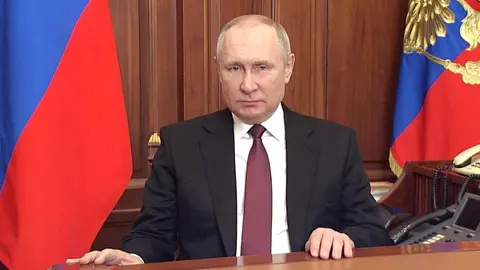 HANDOUT - 24 February 2022, Russia, Moscow: Russian President Vladimir Putin gives a televised address announcing a special military operation in Donbass. Photo: -/Kremlin/dpa - ATTENTION: editorial use only and only if the credit mentioned above is referenced in full.