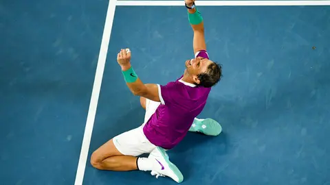 31 January 2022, Australia, Melbourne: Spanish tennis player Rafael Nadal celebrates defeating Russia's Daniil Medvedev to win their Men's Singles Final tennis match of the Australian Open. Photo: James Ross/AAP/dpa.