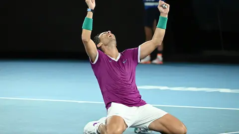 31 January 2022, Australia, Melbourne: Spanish tennis player Rafael Nadal celebrates defeating Russia's Daniil Medvedev to win their Men's Singles Final tennis match of the Australian Open. Photo: Dean Lewins/AAP/dpa