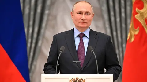 HANDOUT - 22 February 2022, Russia, Moscow: Russian President Vladimir Putin speaks during a press conference at the Kremlin. The world judo governing body (IJU) has taken personal action against Russian President Vladimir Putin following the invasion of Ukraine. Photo: -/Kremlin/dpa - ATTENTION: editorial use only and only if the credit mentioned above is referenced in full.