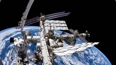FILED - 02 December 2021, ---: A picture from NASA astronaut Thomas Marshburn's camera shows the International Space Station (ISS) and the Earth below. The chief of the Russian space agency Roscosmos suggested the International Space Station (ISS) could crash, as he railed against Western sanctions imposed on Russia in the wake of the invasion of Ukraine. Photo: NASA/dpa - ATTENTION: editorial use only and only if the credit mentioned above is referenced in full