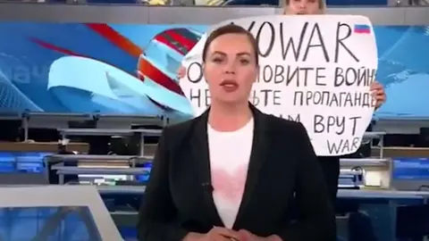 Marina Ovsyannikova walked onto set during the country's main news programme "Vremya" (Time) and held up a sign to the camera protesting President Vladimir Putin's war in Ukraine, warning that viewers were being "lied to." Image: YouTube screenshot.