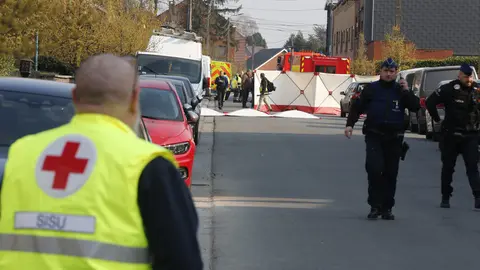 20 March 2022, Belgium, Strepy-Bracquegnie: Policemen and paramedics work at the accident site where a car drove into a Carnival gathering in the Belgian town of Strepy-Bracquegnie. Four people were killed and 12 people were seriously injured and about twenty slightly. Photo: Nicolas Maeterlinck/BELGA/dpa.
