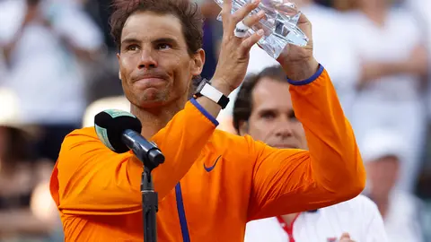 20 March 2022, US, Indian Wells: Spanish tennis player Rafael Nadal holds the runner-up trophy after the Men's Singles Final Tennis match against USA's Taylor Fritz during the Indian Wells Masters tennis tournament at Indian Wells Tennis Garden. Photo: Charles Baus/CSM via ZUMA Press Wire/dpa.