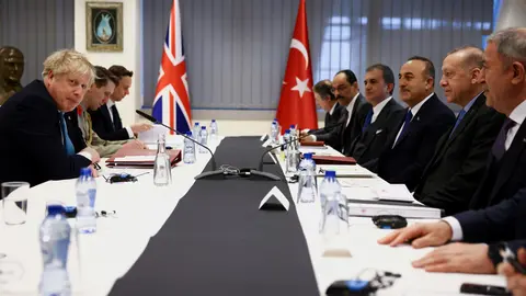 24 March 2022, Belgium, Brussels: UK Prime Minister Boris Johnson (L) meets with Turkish President Recep Tayyip Erdogan (2nd R) on teh sidelines of a special meeting of NATO Leaders to discuss Russia's invasion of Ukraine. Photo: Henry Nicholls/PA Wire/dpa.