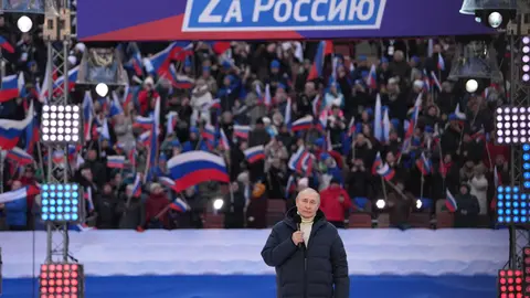 HANDOUT - 18 March 2022, Russia, Moscow: Russian President Vladimir Putin delivers a speech during a concert held to mark the eighth anniversary of Russia's annexation of Crimea at the Luzhniki stadium. Photo: -/Kremlin/dpa - ATTENTION: editorial use only and only if the credit mentioned above is referenced in full.